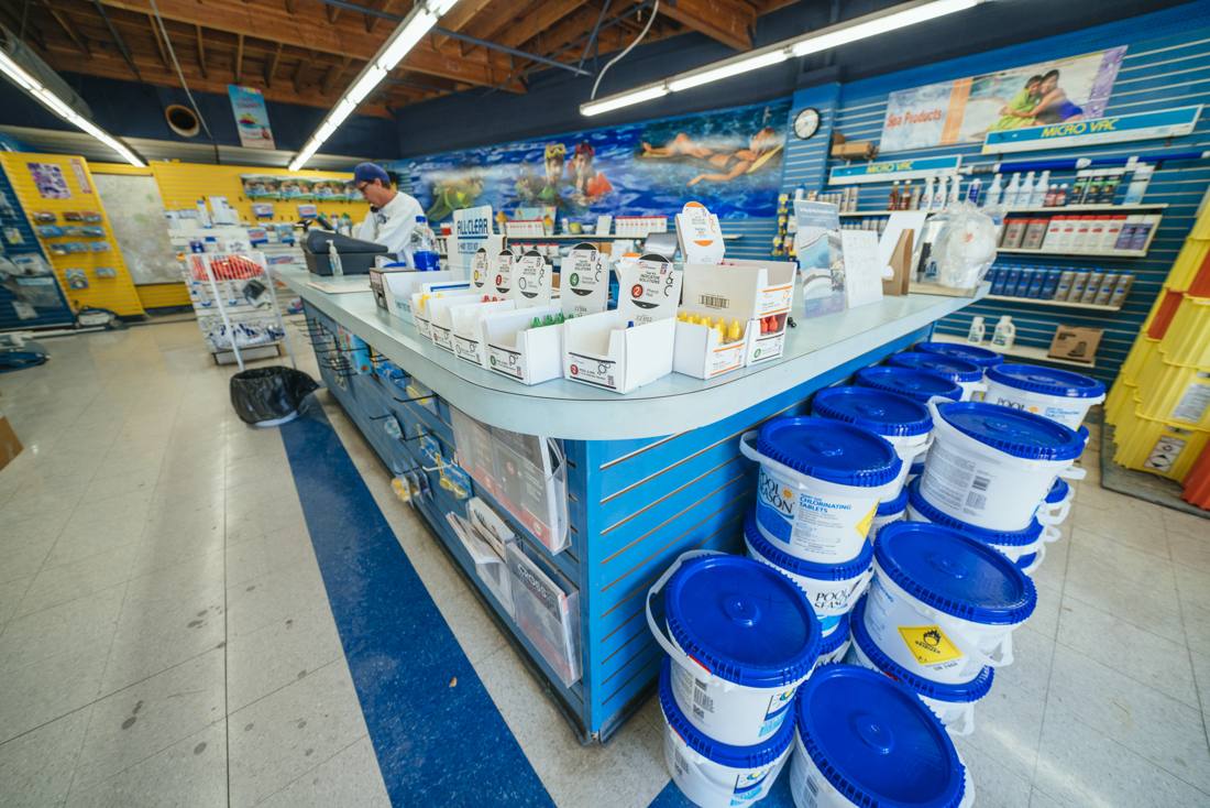 The counter and water-testing station inside an SK Pools store
